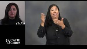 Split screen with right screen with African-American woman wearing light green sweater vest; Left screen has native Woman with black hair wearing black shirt and grey sweater; Catie center logo in lower left.